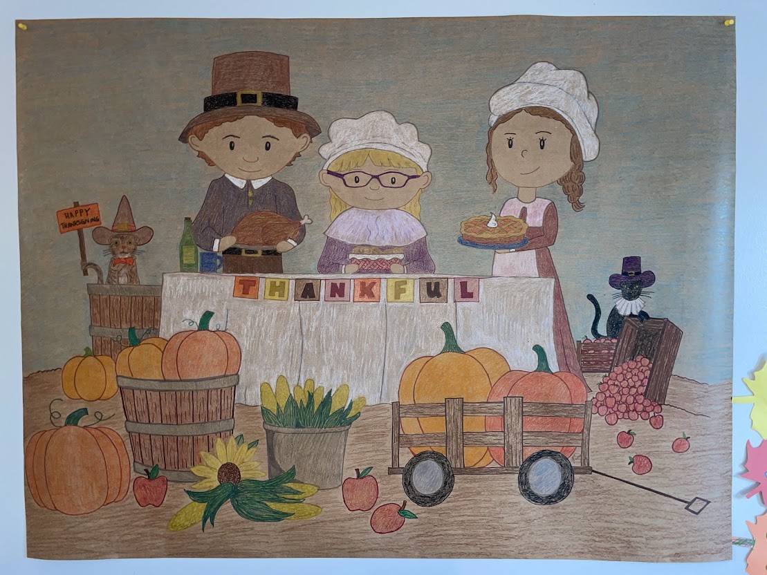 Detail of the finished Thanksgiving banner showing the fully rendered pilgrim family and THANKFUL block lettering