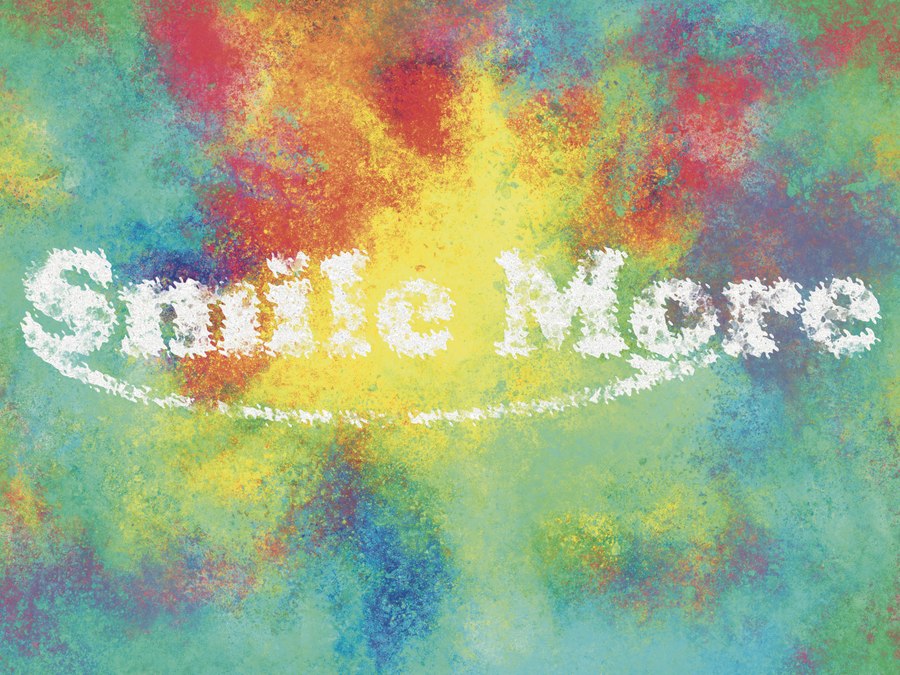 Hand-lettered Smile More over a burst of sprayed color