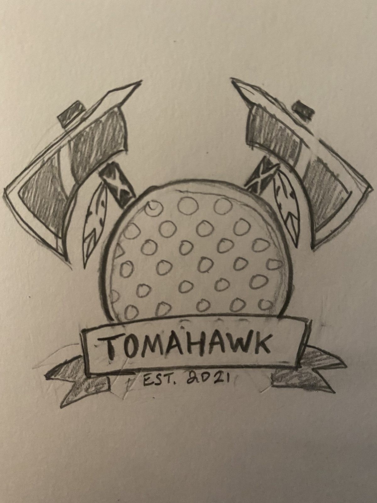 Hand-drawn pencil concept for the Team Tomahawk badge — two crossed axes with feathers framing a dimpled ball and a banner reading Tomahawk, Est. 2021